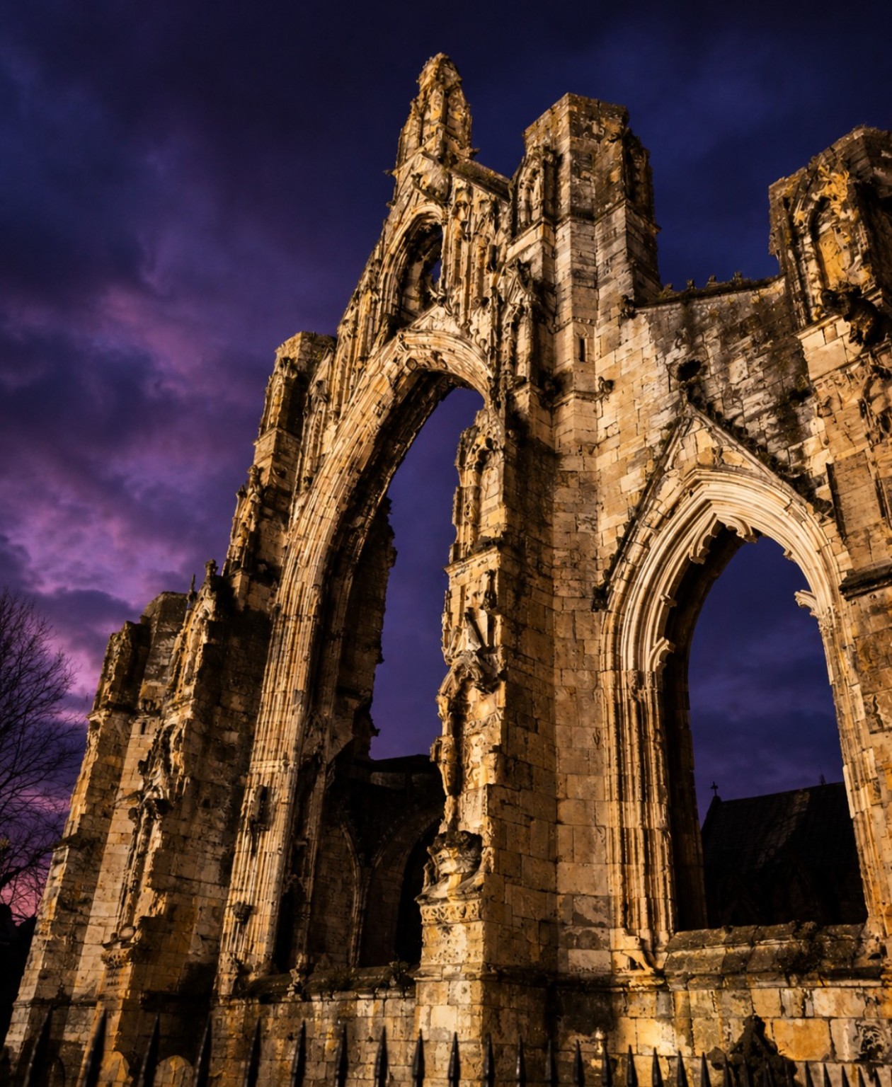 Historic abbey ruins illuminated at night